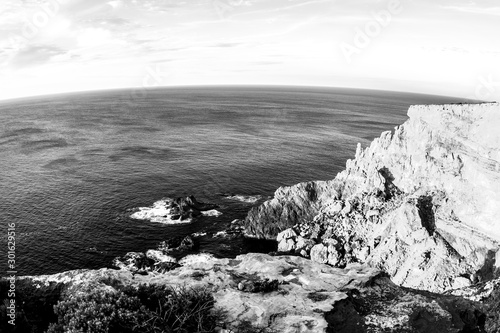 Black and white seaside at sunset, South Australia, Kangaroo Island. Fisheye image.