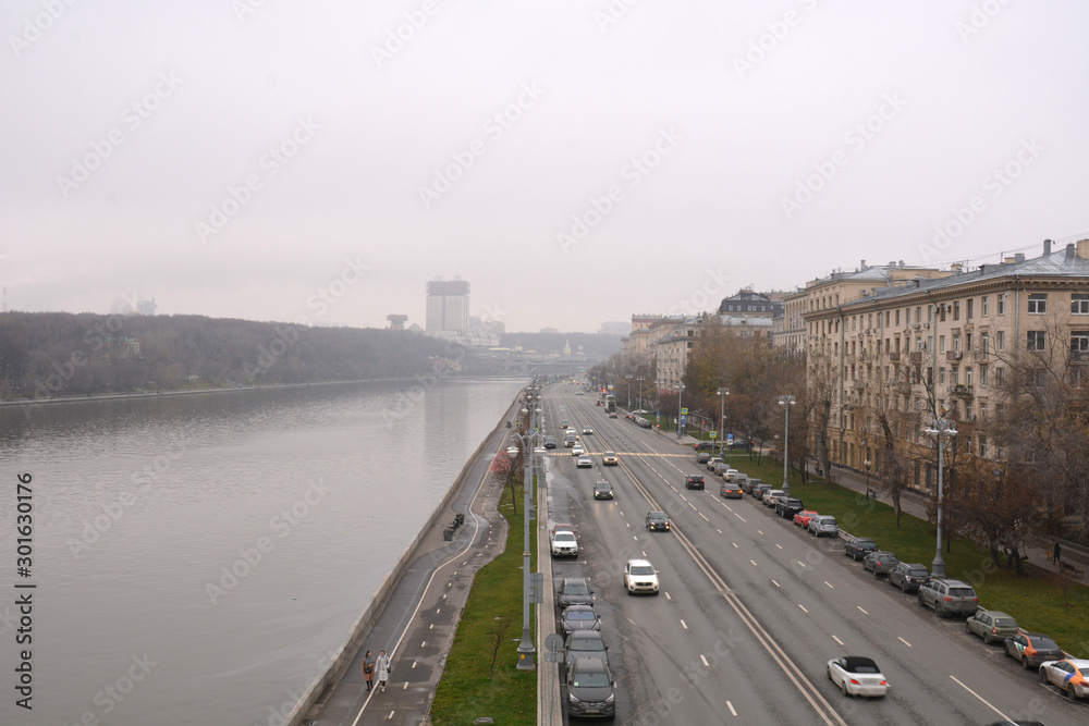 Moscow, Russia -08.11.2019:  The view to the Moskva river and Frunze embankments from the Krymsky bridge. Overcast sky in the background