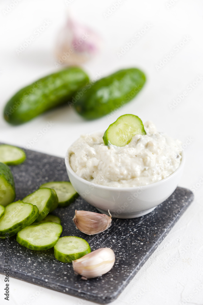 Greek tzatziki sauce with yogurt, cucumbers and garlic Greek tzatziki sauce with yogurt, cucumbers and garlic