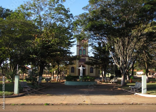 Beautiful Catholic church and its tree-filled square in the rural district of Guarapiranga, Ribeirão Bonito, São Paulo, Brazil, on a sunny day - Guarapiranga, Araraquara/SP photo