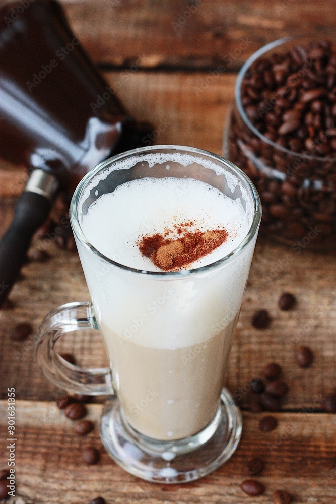 Roasted coffee beans and a cinnamon Dolce latte Roasted coffee beans and a cinnamon Dolce latte