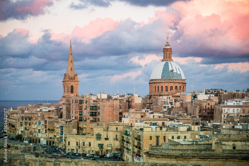 Historical Valletta Skyline with sunset clouds