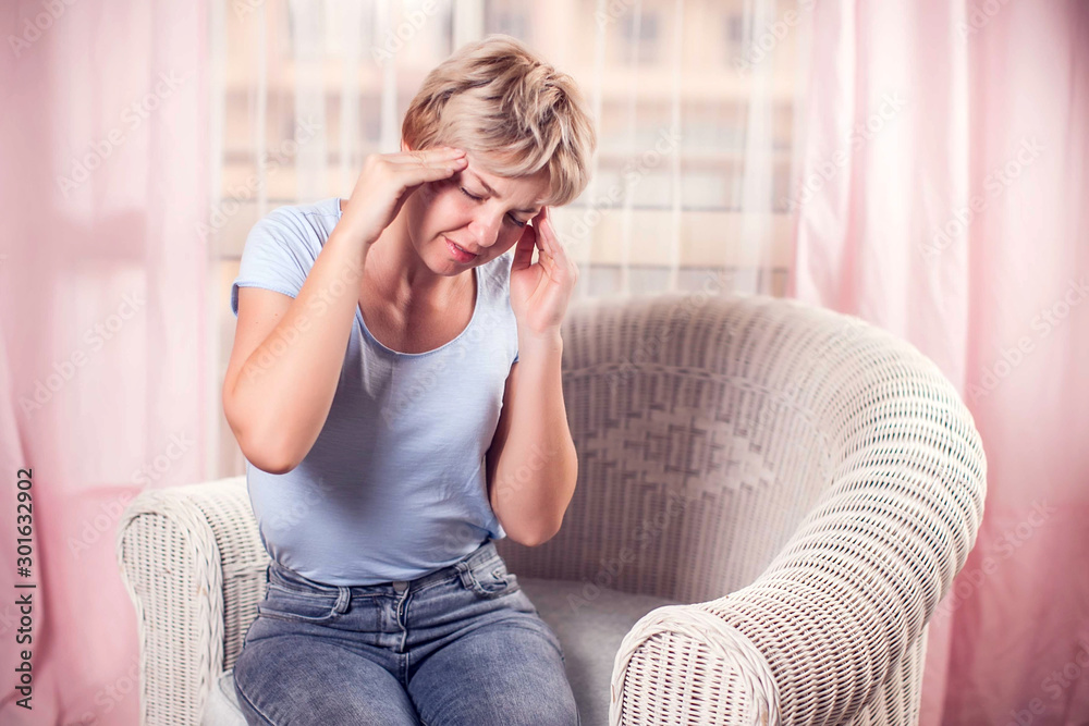 Fototapeta premium Woman feels strong headache. People, healthcare and medicine concept