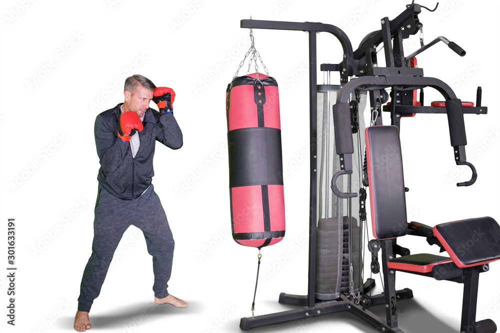 Young man is boxing exercises in the studio