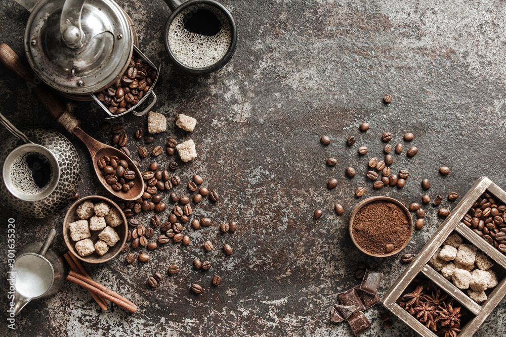 Coffee cup with coffee grinder and coffee beans on dark textured background. Coffee cup with coffee grinder and coffee beans on dark textured background.