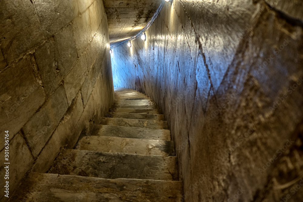 Stone steps. Old staircase leading up towards the light.