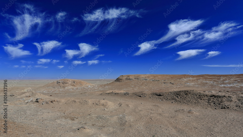 Cirrus uncinus-mares.tails clouds over yardangs-wind eroded rock surfaces. Qaidam desert-Qinghai-China-0563