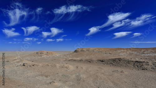 Cirrus uncinus-mares.tails clouds over yardangs-wind eroded rock surfaces. Qaidam desert-Qinghai-China-0563