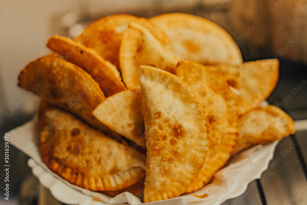 frying homemade pastries at home, brazilian cultural salty food frying homemade pastries at home, brazilian cultural salty food