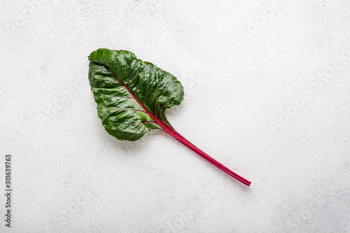 beet tops on a white background top view of a single sheet