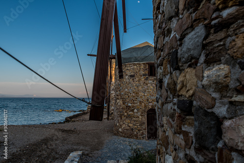 Famous windmills of Chios island a little before the sunset, Greece © Stamatios
