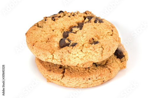 Homemade cookies. Two sweet cookies with chocolate chips. Tasty biscuit in high resolution close-up  isolated on white background with small shadows. Homemade bakery.