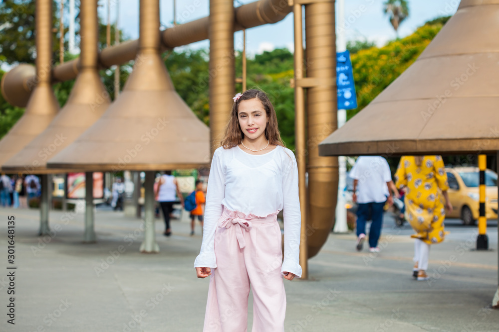 Beautiful young girl at the Jairo Varela Square in the city of Cali in Colombia Beautiful young girl at the Jairo Varela Square in the city of Cali in Colombia