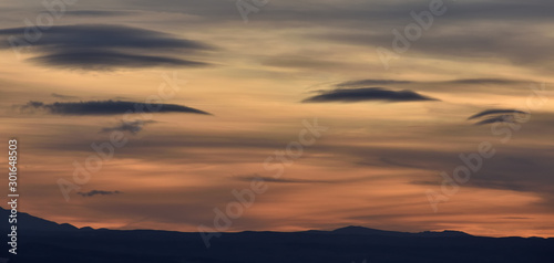 splendid autumn sunset with different types and colors of lenticular clouds © Miguel Ángel RM