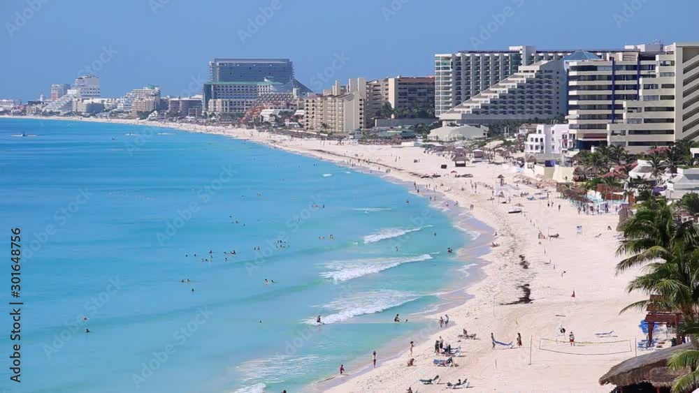 Caribbean sandy beach with turquoise water. Resorts along coastline Caribbean sandy beach with turquoise water. Resorts along coastline