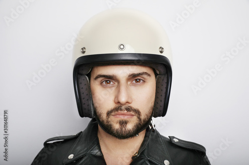 Close-up portrait of biker with white helmet. Isolated.