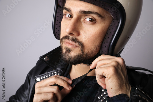 Close-up portrait of biker with white helmet. Isolated.