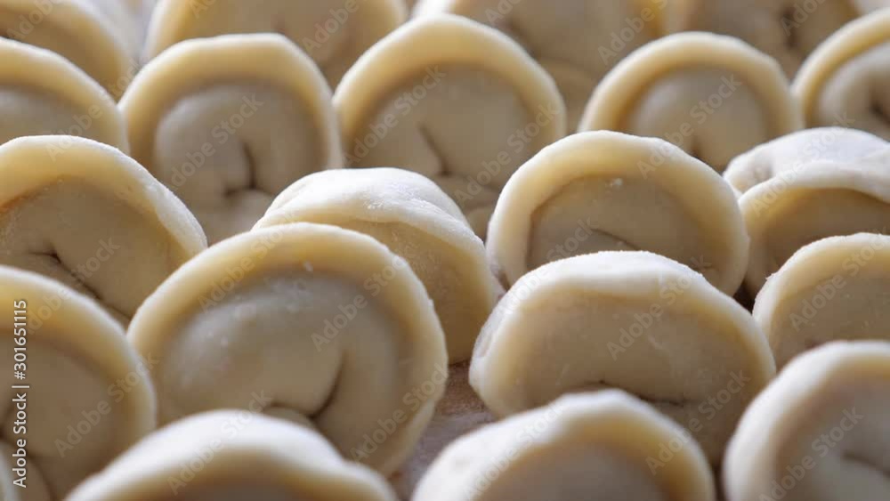 Homemade meat dumplings, closeup. Russian traditional meal. Rotate
