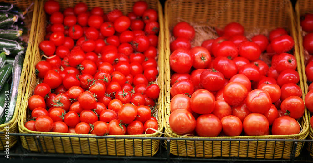 Market, tomatoes in the vegetable department Market, tomatoes in the vegetable department