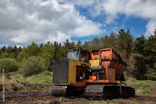  Heavy machinery used for cultivating peat bog in the Irish countryside