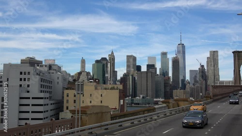 New York, United States - October 16, 2019: Cars speeding on the Brooklyn Bridge, Manhattan. One of the most emblematic bridges in the world, a must-see attraction when visiting New York.