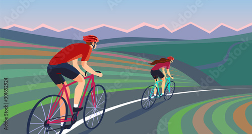Pair of cyclists on the road near the hills banner.