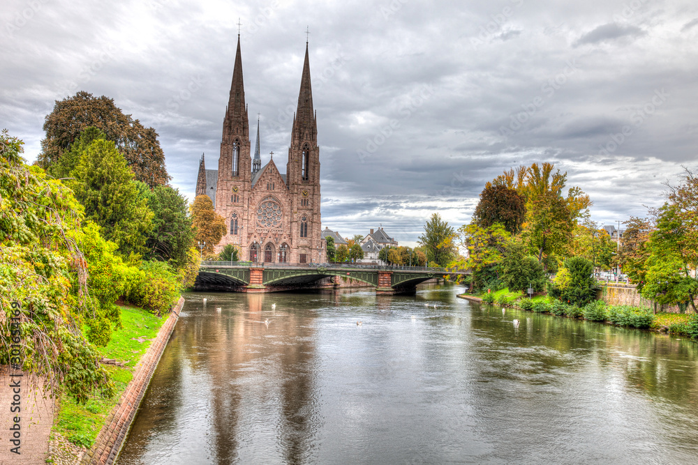 Church in Strasbourg, France on the canal