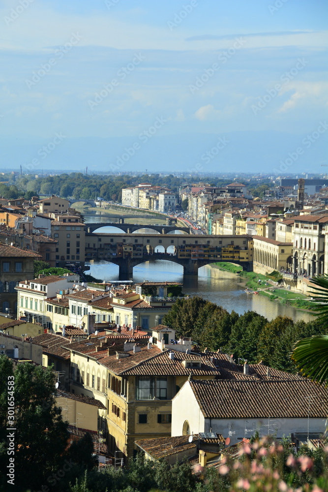 The Ponte Vecchio bridge and the Arno river in Florence Italy.
