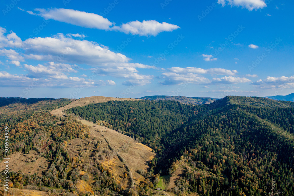 Beautiful mountain landscape, with mountain peaks covered with forest and a cloudy sky. Ukraine mountains, Europe Beautiful mountain landscape, with mountain peaks covered with forest and a cloudy sky. Ukraine mountains, Europe