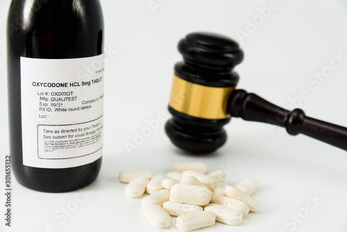 Bottle of oxycodone obtained illegally, concept of medical false prescriptions. photo