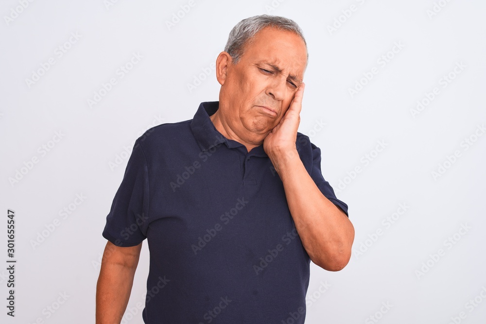 Senior grey-haired man wearing black casual polo standing over isolated white background thinking looking tired and bored with depression problems with crossed arms. Senior grey-haired man wearing black casual polo standing over isolated white background thinking looking tired and bored with depression problems with crossed arms.