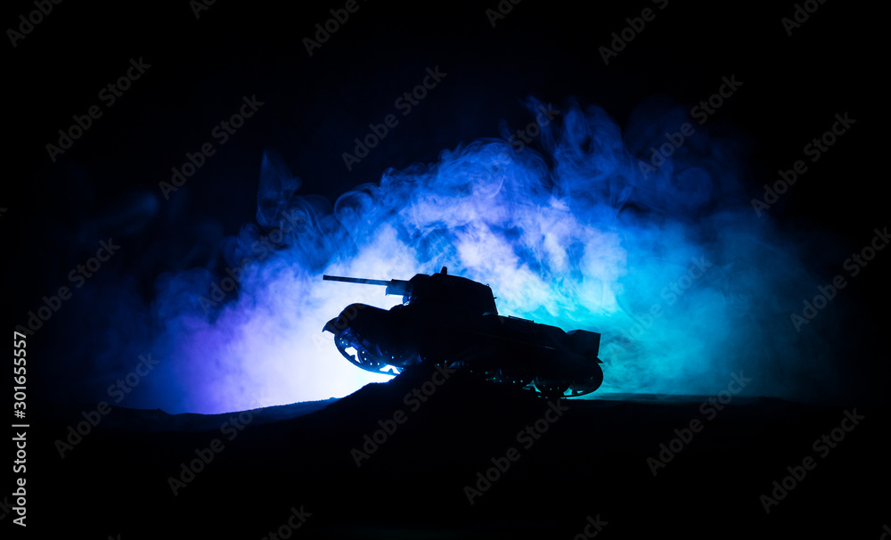 War Concept. Military silhouettes fighting scene on war fog sky background, Silhouette of armored vehicle below Cloudy Skyline At night. Attack scene. Tanks battle.