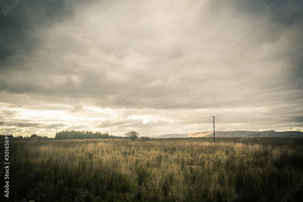 Fantasy rural landscape with fields and blurry sky Fantasy rural landscape with fields and blurry sky