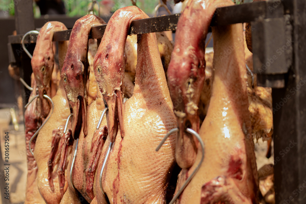 some ducks getting grilled on a clothesline some ducks getting grilled on a clothesline