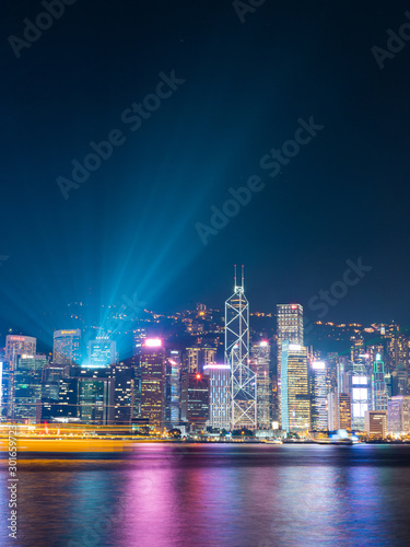 Hong Kong skyline at night with laser from the top of building. © AlexandraDaryl