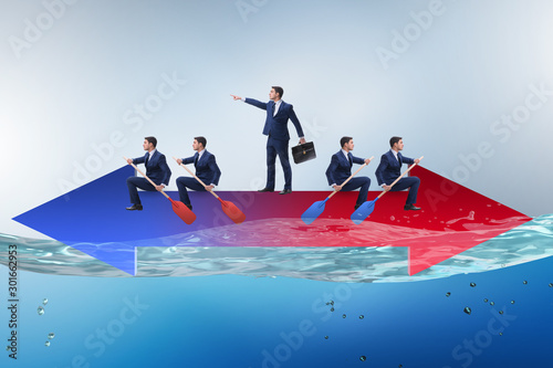 Disagreement concept with businessmen rowing in different direct photo