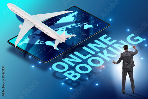 Concept of online airtravel booking with businessman photo