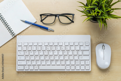 Office desk workspace and table background from top view above flat lay objects. Modern minimal design desktop for creative working. Minimalism concept. photo