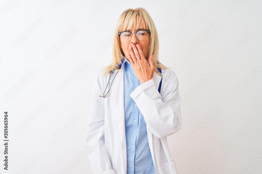 Middle age doctor woman wearing glasses and stethoscope over isolated white background bored yawning tired covering mouth with hand. Restless and sleepiness. Middle age doctor woman wearing glasses and stethoscope over isolated white background bored yawning tired covering mouth with hand. Restless and sleepiness.