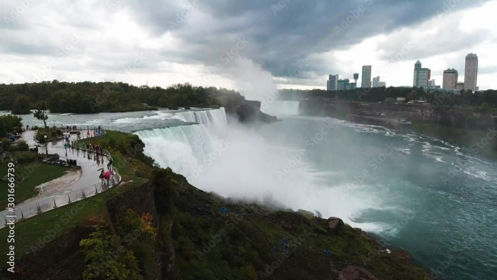 View of Niagara Falls from boat, rocky edge of waterfall, famous destination of North America, nature of Northeast USA, fast water flow, dense fog, travel around America View of Niagara Falls from boat, rocky edge of waterfall, famous destination of North America, nature of Northeast USA, fast water flow, dense fog, travel around America