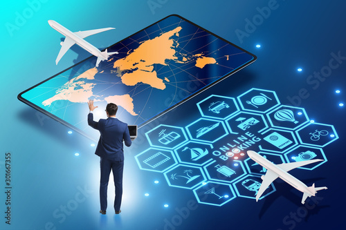 Concept of online airtravel booking with businessman photo