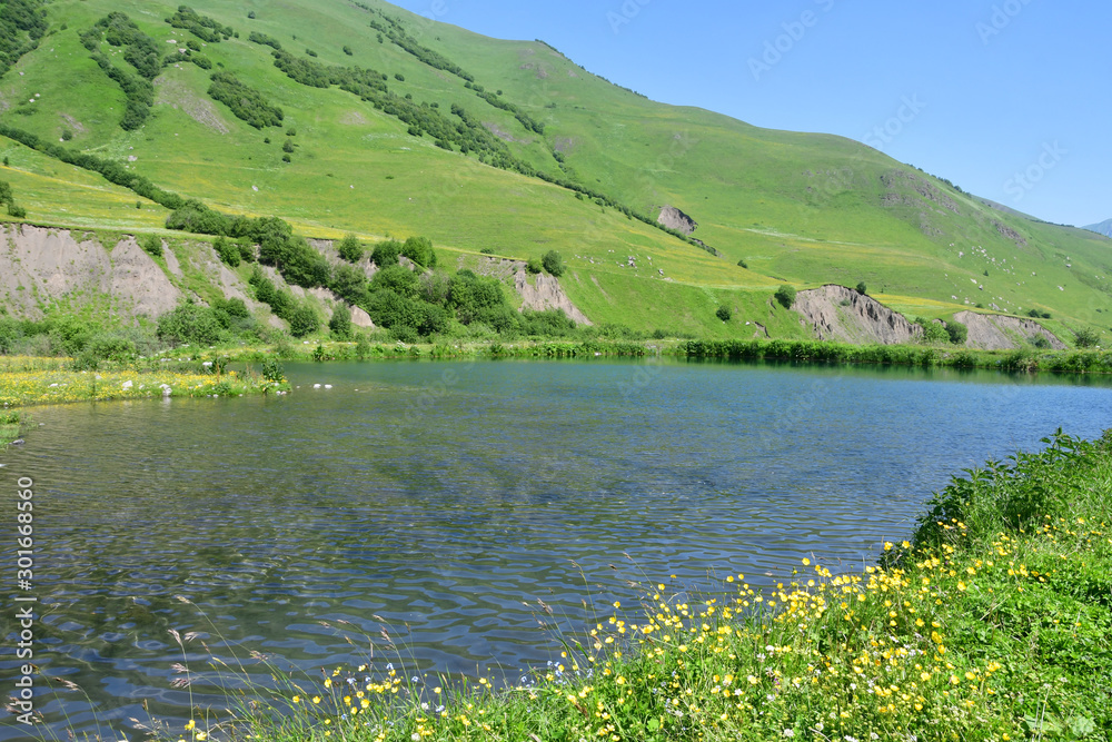 Russia, North Ossetia. Midagrabin (Midagrabinskoe) lake in the mountains in summer