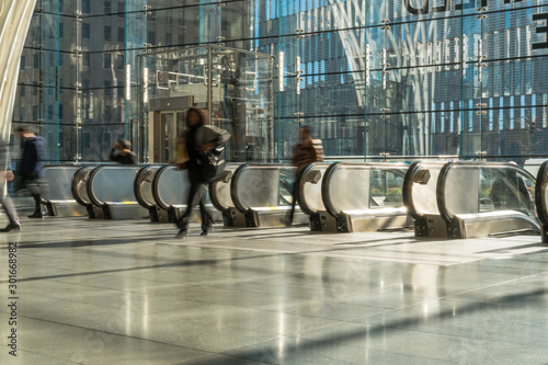 NEW YORK, USA - APR 2019 : Unrecognizable passenger and tourist walking up to the escalator to office in rush hour on April 3, 2019, lower Manhattan,New York, United state
