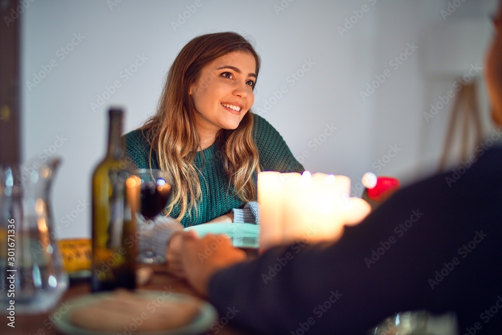 Young beautiful couple smiling happy and confident. on romantic meeting at home