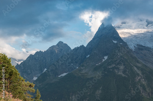 Panorama of mountains and forest scene in national park of Dombay, Russia © TravelFlow