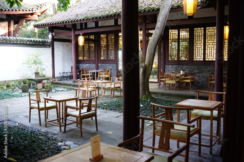 Fotografie Traditional setting of an outdoor oriental tea house with wooden table and chair at chengdu, China