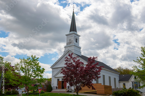 New Hope Fellowship Church on Main Street in Maynard historic town center in summer, Maynard, Massachusetts, USA.