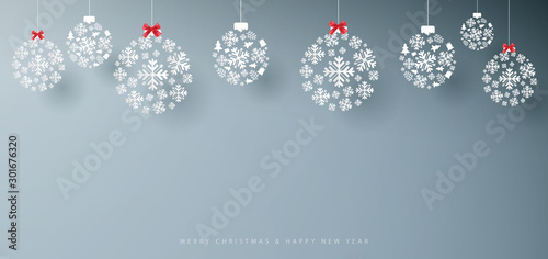 Merry Christmas and Happy New Year banner. Abstract white snowflakes on grey background. Paper art and craft design. Space for your design