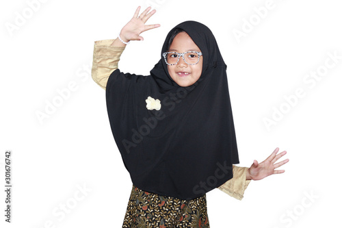 Portrait of cute A young asian little girl 6-7 years old muslim, wearing hijab, show face expression