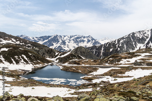 Alpine lake in the Gotthard pass the swiss alps between the Canton of Ticino and Uri in Switzerland